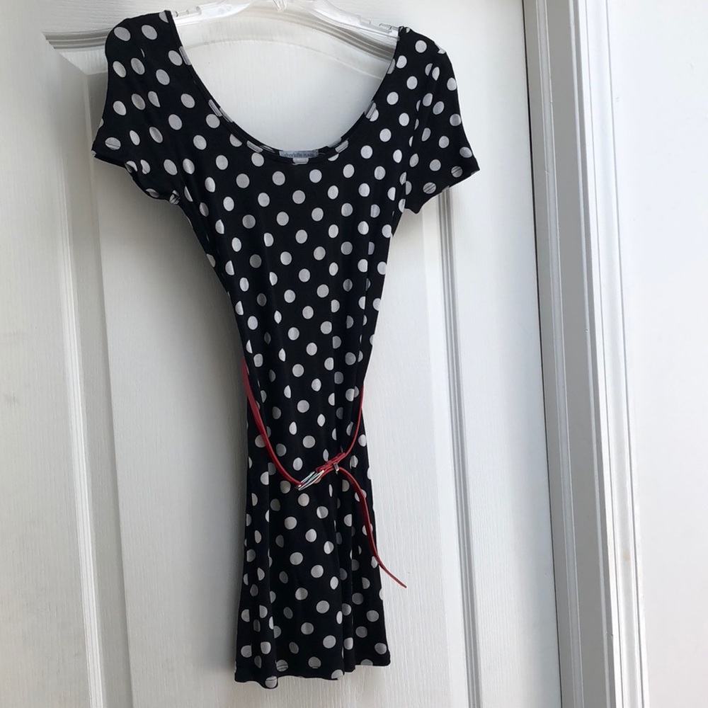 Polka dot mini dress w/ red belt.